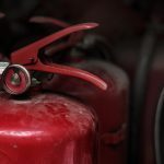 closeup red fire extinguishers